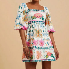 Woman wearing floral puff sleeve mini dress with square neckline