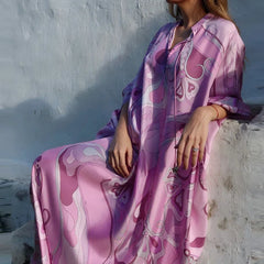 Flowy ankle-length pink dress with swirling patterns
