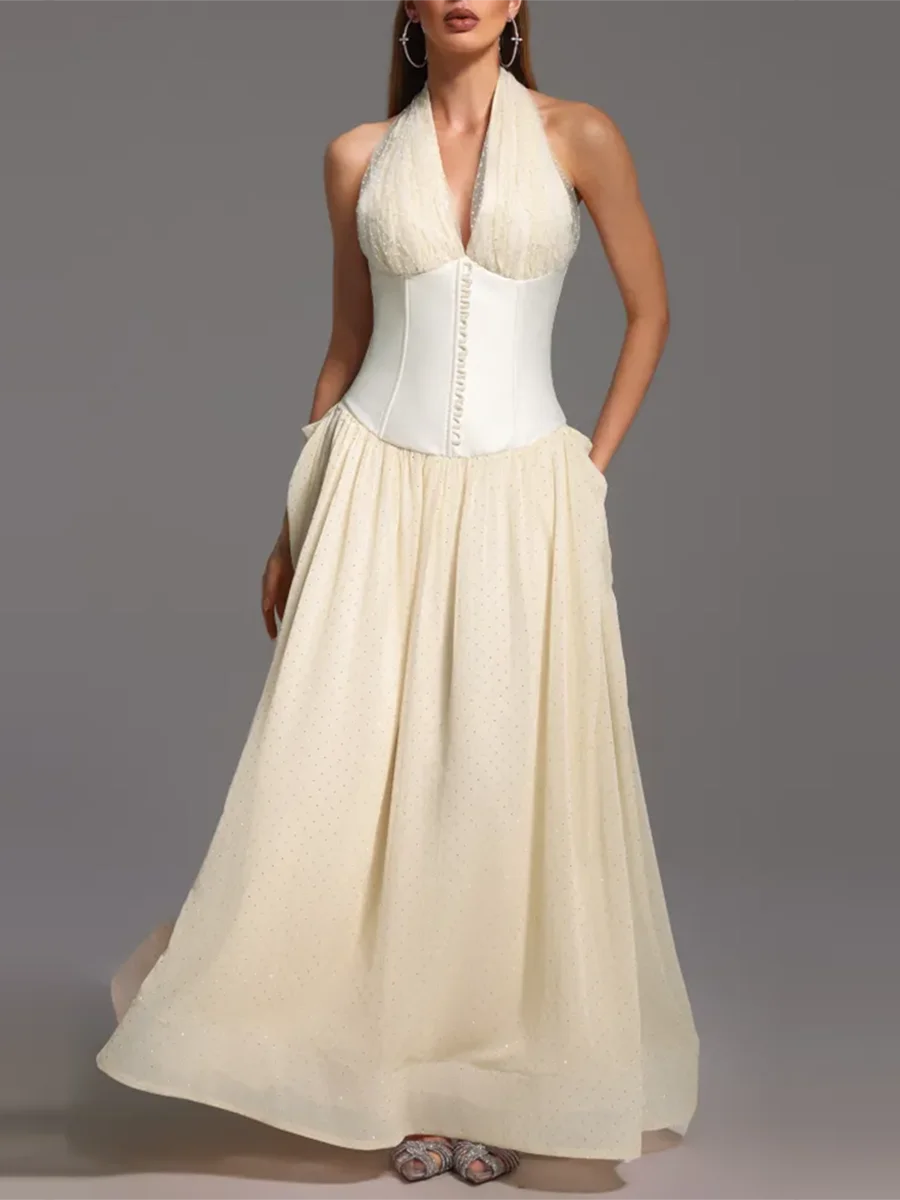 Flowy apricot maxi gown with white bodice styled for elegant summer wear