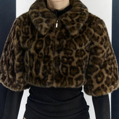 Short leopard print outerwear layered over a fitted black top