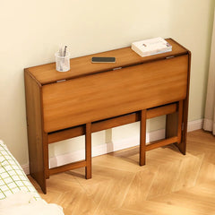 Foldable writing table shown with books and lamp on top shelf