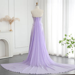 The back view of the elegant gown, highlighting the sweeping train.

