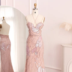 An exquisite formal party dress with a graceful silhouette and a sweep train.