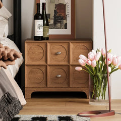 “Solid wood nightstand with double doors in modern bedroom”

