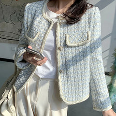 The full length of the short coat, styled for a chic, vintage look.