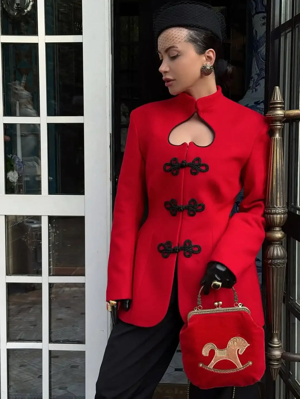 Close view of frog-button trim on a structured tailored jacket