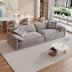 “Close-up of frosted cloth cushions on cream luxury sofa”


