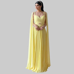 A woman modeling a fuchsia chiffon A-line gown with a sweetheart neckline.