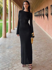 Full sleeve black and gold detail maxi dress shown for night out style