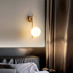 An LED 7W G9 Bulb Indoor Wall Sconces  with a primary image showing a gold-colored sconce in a modern style  over  bed.