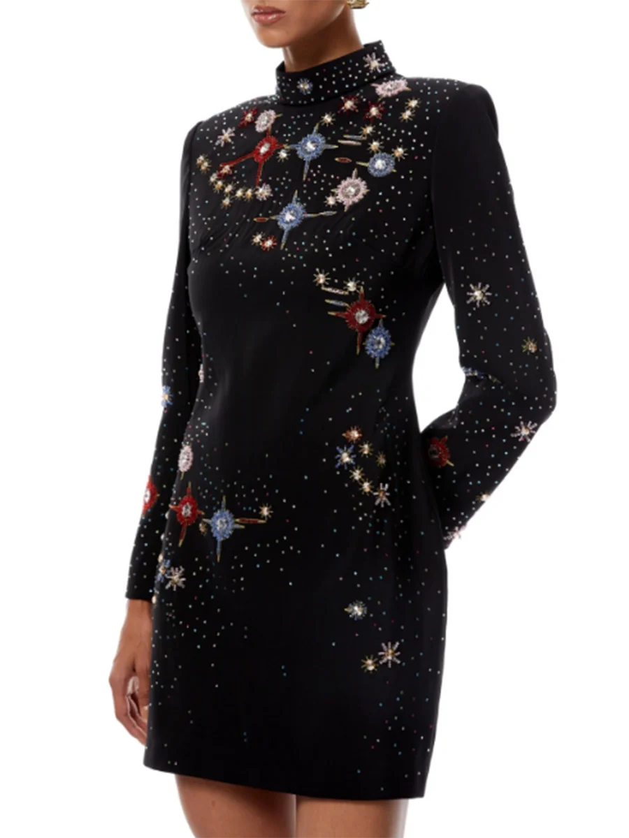 Close-up of constellation placements adding refined sparkle to an editorial evening silhouette