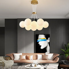Modern lunar design glass ball chandelier suspended in open living area