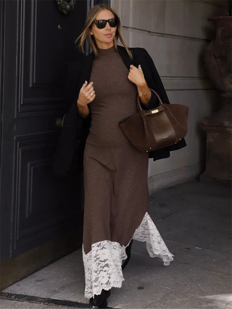 Ankle-length maxi dress with lace hem styled outdoors with a structured bag