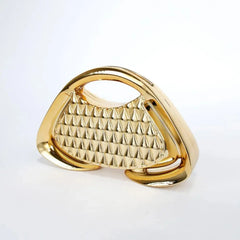 Close-up of geometric detailing on glossy acrylic evening clutch