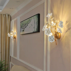 Gilded floral boutique wall light adding softness and artisan glow