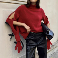 Close view showing glove-style sleeve detailing and patchwork knit texture