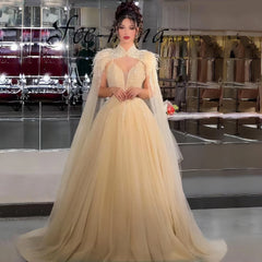 Gold feather beaded evening dress with detachable cape for luxury weddings, with a cape in a store setting