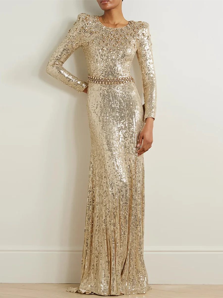 “Gold sequin long sleeve gown with floor-length A-line silhouette”

