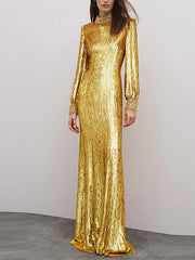 Gold sequined long sleeve maxi dress styled on a model against a soft neutral backdrop.