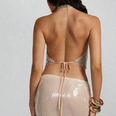 Back view of gold sequin halter top showing open-back design