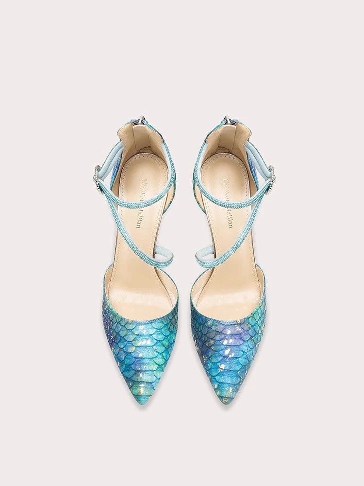 Gold stiletto party sandals in blue with crystal embellishments
