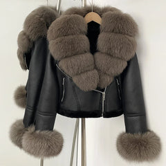 Cropped black faux leather jacket on a hanger with oversized taupe fur collar, zip front, and plush fur cuffs