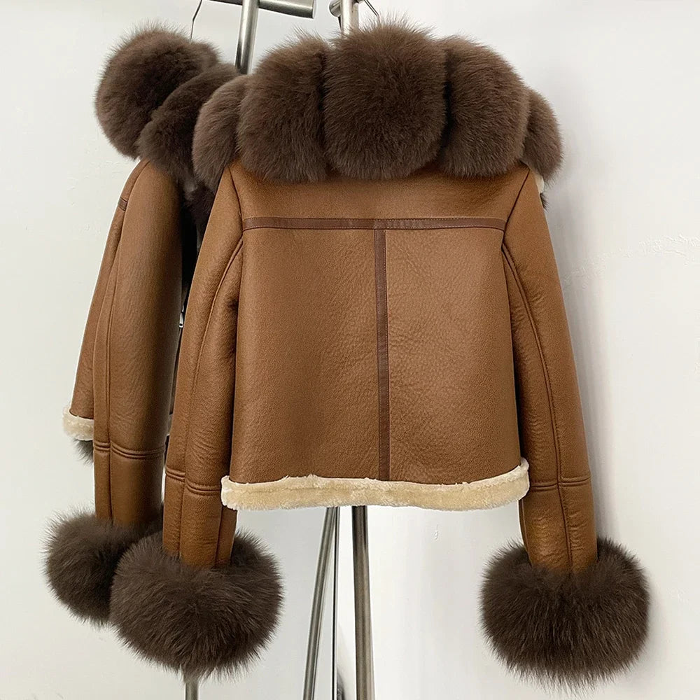 Detail shot of the fur cuff finish and sleeve shape, emphasizing the rounded trim and smooth outer surface.