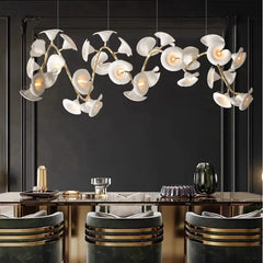 Golden leaf pendant above a contemporary breakfast bar