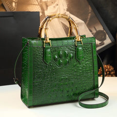Green crocodile embossed leather satchel with bamboo handles