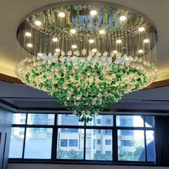 Green crystal rainfall chandelier in a luxury hotel lobby