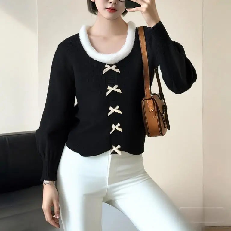 A woman wearing a sweet-style hairy-edge knitted cardigan with a butterfly bow.