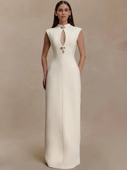 Sleeveless high-collar maxi dress with a vertical cut-out shown in a studio setting, highlighting its clean lines and elongated silhouette.