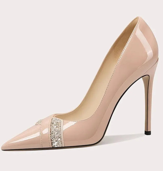 A front view of a high-heel pump, highlighting the thin heel and elegant design.