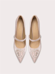 A front view of a high-heel pump, highlighting the thin heel and elegant design.