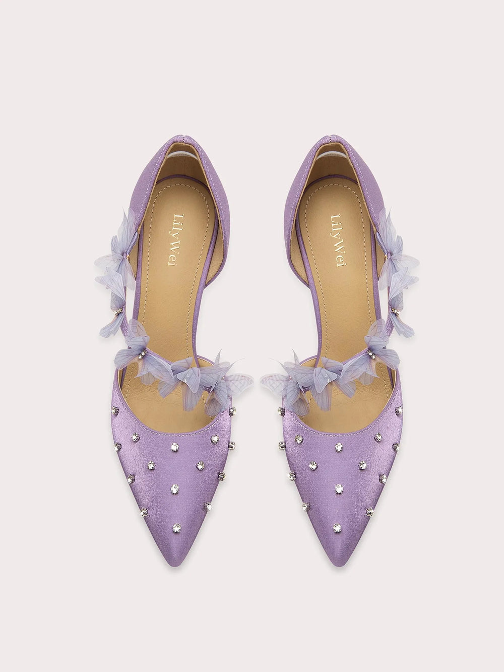 A front view of a high-heel sandal, highlighting the thin heel and elegant design.