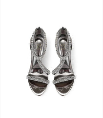 A front view of a high-heel sandal, highlighting the thin heel and elegant design.