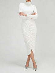 Model standing in a high-neck long sleeve midi dress with gathered ruching and a streamlined silhouette