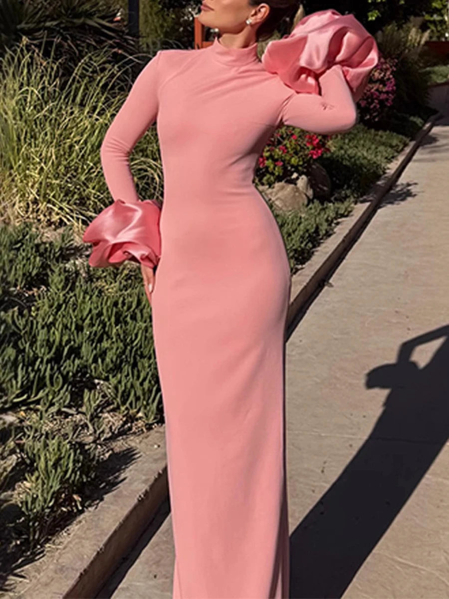 High-neck formal dress in soft pink with sculptural silhouette