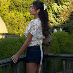 The slim-fit tee worn with jeans for a high-street fashion look.