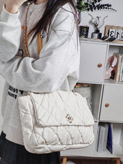 Y2K-inspired pink quilted satchel with chain handle

