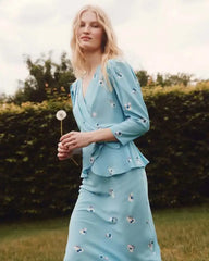 side angle showing slim high-waist floral pencil skirt