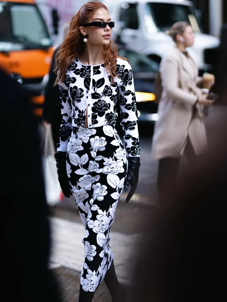 Long-sleeve floral top with front button styling and structured finish