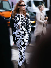 Long-sleeve floral top with front button styling and structured finish