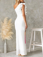 A close-up of the dress showing the high waist and sheath silhouette.


