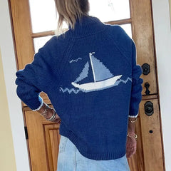 Holiday season sailboat cardigan styled for coffee dates and escapes