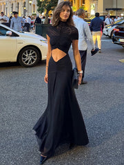 A woman modeling a hollow-out ruched mini dress for a night out.