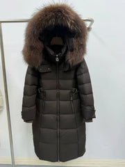 Longline puffer parka displayed front-facing with hood framing the neckline on a clean studio backdrop