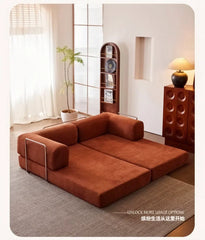 compact velvet sleeper couch folded in modern apartment
