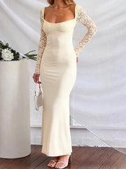 Woman wearing ivory lace sleeve maxi dress with open back