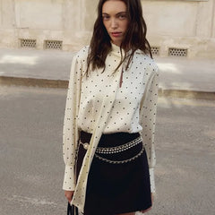 Polka dot long-sleeve blouse with scarf-tie detail and V-neckline